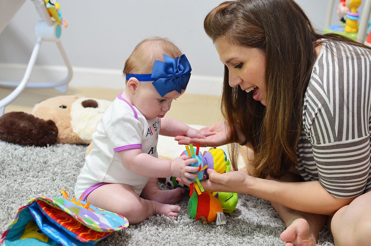 Lila plays and learns with Lamaze toys