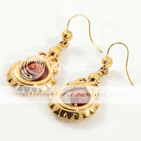 Drop earrings with a goldstone bead made in 9 carat gold and dating to